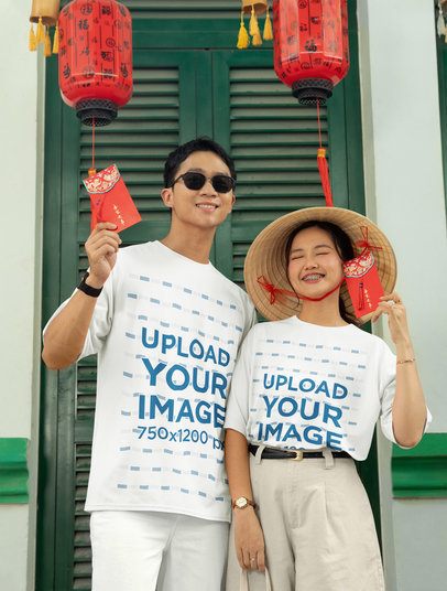 Oversized T-Shirt Mockup Featuring a Happy Man and a Woman Celebrating Lunar New Year m52214