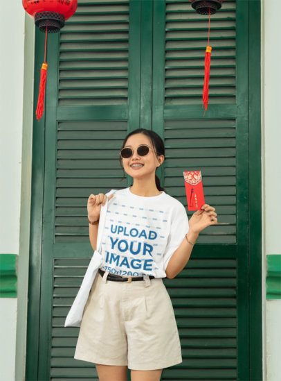 Round-Neck Tee Mockup of a Happy Woman Holding a Lunar Year Envelope m52216