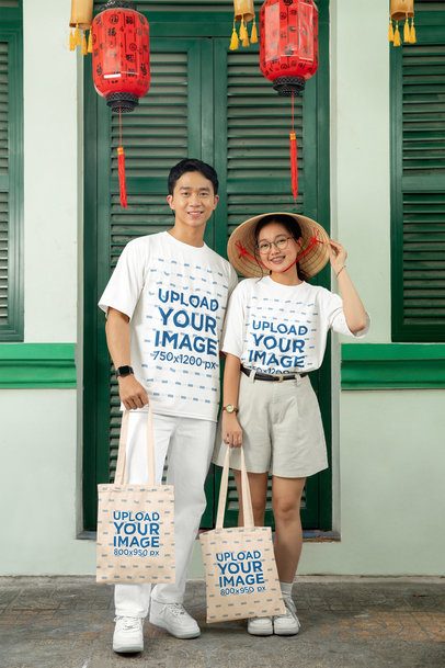 Lunar Year-Themed Mockup of a Couple Wearing Matching T-Shirts and Carrying Tote Bags m52213