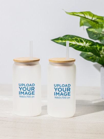 Frosted Libbey Mockup Featuring a Plant in the Background m52413