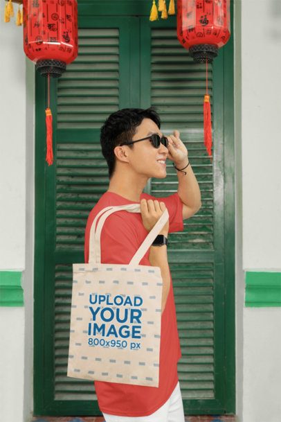 Lunar New Year Mockup of a Happy Man Carrying a Sublimated Tote Bag m52225