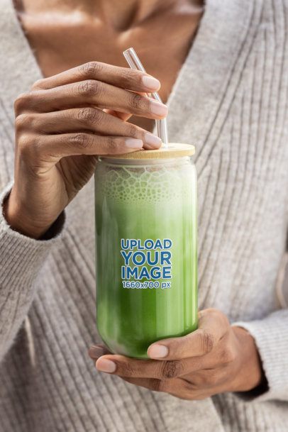 Mockup of a Woman Holding a Sipper Can Glass Filled With Matcha Tea m52434