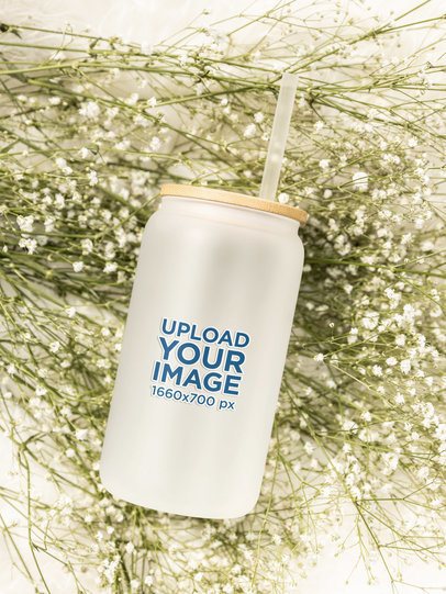 Drinkware Mockup Featuring a Frosted Libbey Placed Above Some Flowers m52436
