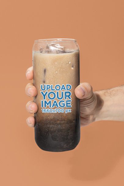 Mockup of a Man Holding a Can Glass Filled With Iced Coffee m52409