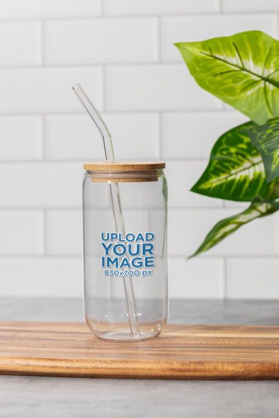 Mockup of an Empty Sipper Can Glass Placed on a Wooden Surface in a Kitchen m52421