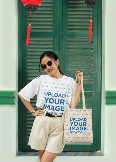 Round-Neck T-Shirt Mockup Featuring a Cheerful Woman Carrying a Tote Bag for Lunar New Year m52221