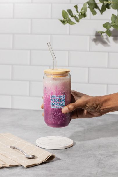 Drinkware Mockup Featuring a Woman Showing a Sipper Can Glass With a Pink Beverage m52423