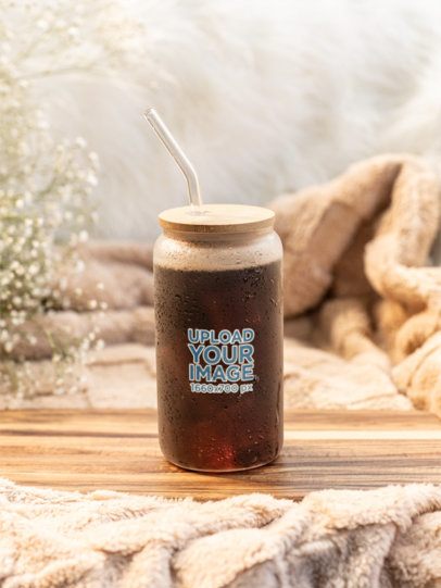 Mockup of a Frosted Libbey Placed in a Cozy Environment and Filled With Iced Coffee m52429