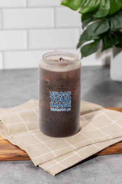 Mockup of a Frosted Can Glass Filled With a Soda Drink Placed on a Kitchen m52441