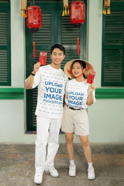 Lunar Year-Inspired Mockup of a Happy Couple Wearing T-Shirts and Holding Red Envelopes  m52226