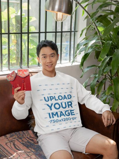 Sweatshirt Mockup of a Happy Man Celebrating the Lunar Year with a Red Envelope m52241
