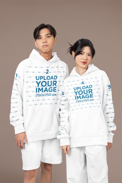 Mockup Featuring Two Teenagers Wearing Matching Hoodies with Customizable Sleeves