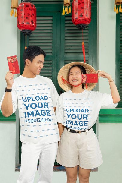 T-Shirt Mockup of a Happy Couple Celebrating the Chinese New Year with Red Envelopes m52227