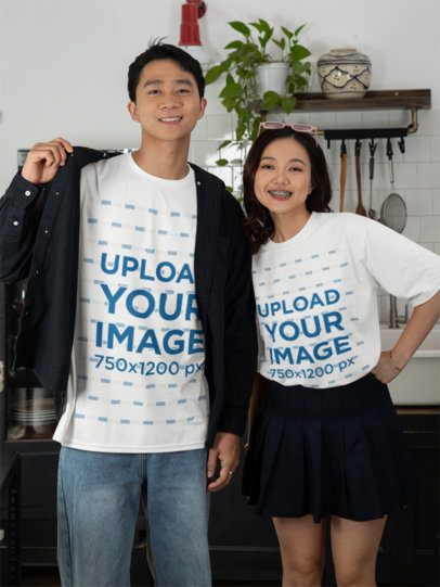 T-Shirt Mockup of a Smiling Man and a Woman Wearing Matching Outfits at Home m52249