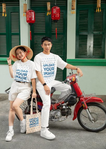 Tote Bag and T-Shirt Mockup of a Couple in a Chinese New Year-Decorated Setting m52230