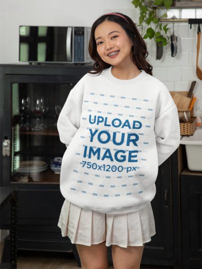 Mockup Featuring a Smiling Woman Wearing a Crewneck Sweatshirt at Home m52252
