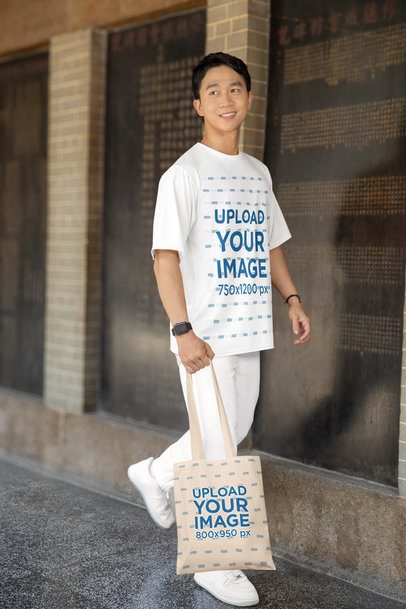Crewneck Tee and Tote Bag Mockup Featuring a Man Walking on the Street  m52210