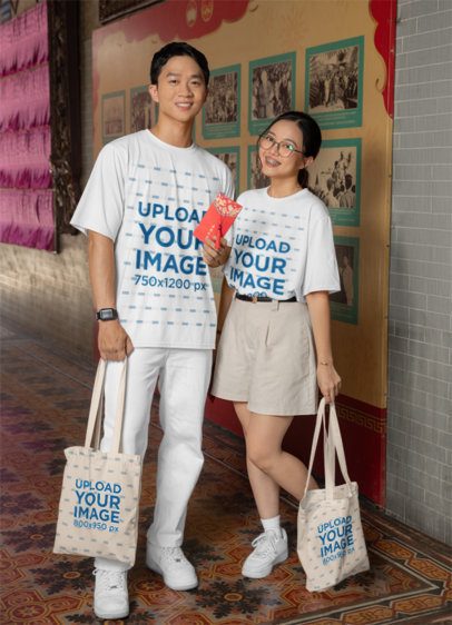 T-Shirt and Tote Bag Mockup Featuring a Smiling Couple Celebrating the Chinese New Year