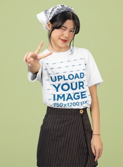 Round-Neck Tee Mockup of a Teenager Making a Peace Sign and Winking Her Eye m51441