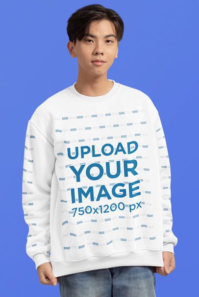 Mockup of a Teenage Boy Wearing a Sweatshirt with Customizable Sleeves in a Studio