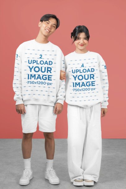 Mockup Featuring Two Teenagers Wearing Sweatshirts with Customizable Sleeves