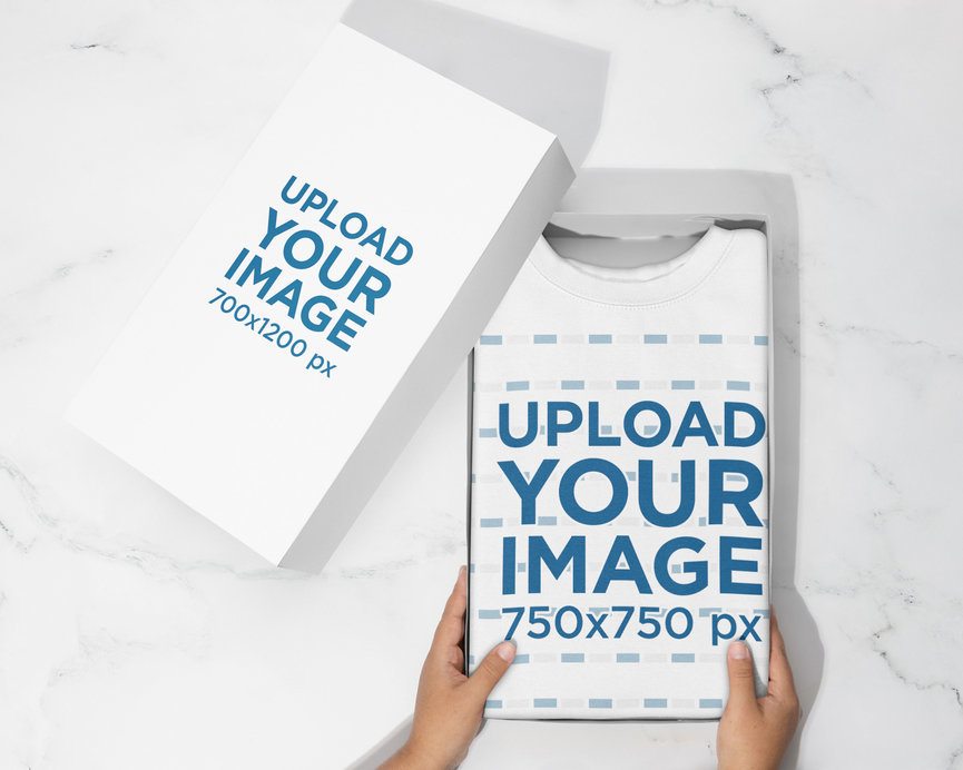 Cotton Heritage Mockup Featuring a Person Holding a Box With a Folded Sweatshirt