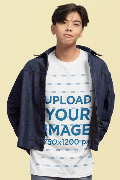 Mockup Featuring a Teenage Boy Wearing a Rounded-Neck T-Shirt in a Studio