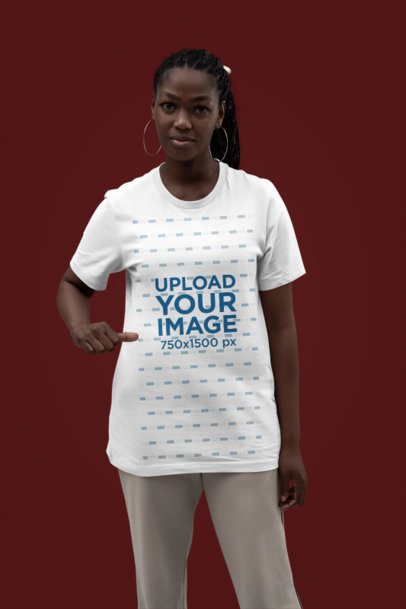 Mockup Featuring a Woman Pointing at Her New Rounded-Neck Bella Canvas T-Shirt