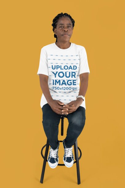 Bella Canvas T-Shirt Mockup of an Older Woman Sitting on a Stool