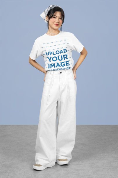 Rounded-Neck Tee Mockup of a Happy Teenage Girl Posing in a Studio