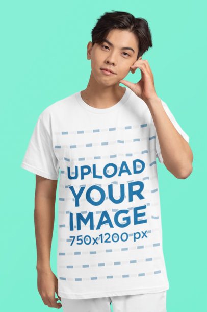 Mockup Featuring a Teenage Boy Wearing a Crewneck T-Shirt in a Studio