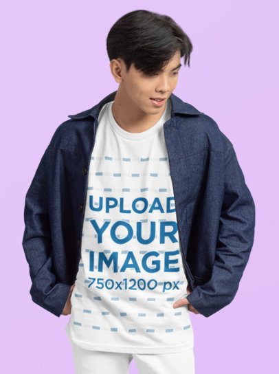Mockup of a Teenage Boy Wearing an Oversized T-Shirt with a Round Neck in a Studio