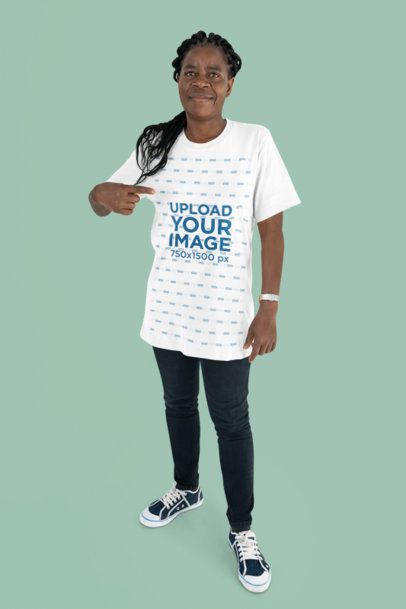Bella Canvas Mockup Featuring a Smiling Senior Woman Pointing at Her T-Shirt