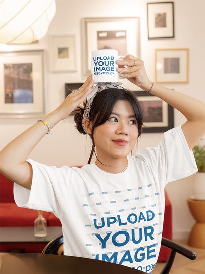 T-Shirt Mockup Featuring a Teenage Girl Putting a Coffee Mug on Her Head