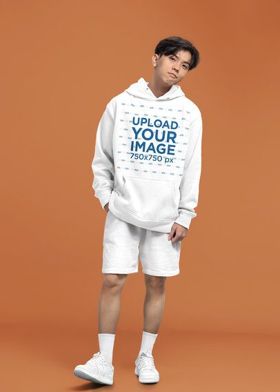 Mockup of a Teenager Wearing a Pullover Hoodie in a Minimalist Setting  m51434