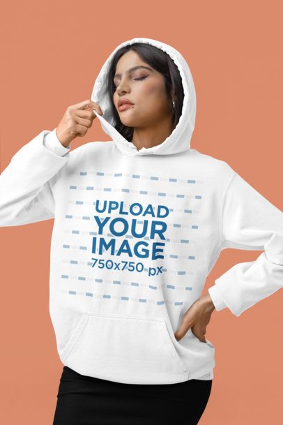 Mockup of a Woman Posing in a Studio with a Comfort Colors Pullover Hoodie m53145