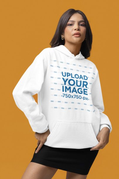 Comfort Colors Hoodie Mockup Featuring a Woman Standing in a Studio With a Serious Look m53143