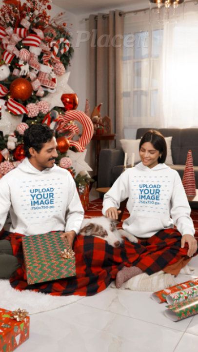 Gildan Hoodie Video of a Cheerful Couple in a Xmas Celebration With Their Dog
