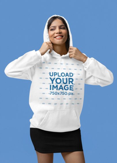Mockup of a Smiling Woman Wearing a Pullover Hoodie by Comfort Colors in a Studio m53144