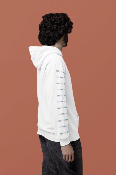 Mockup of a Curly-Haired Man Standing in a Studio While Wearing a Comfort Colors Hoodie m53163