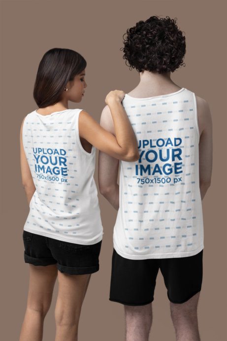 Back-View Mockup of a Man and a Woman Wearing Tank Tops by Comfort Colors in a Studio