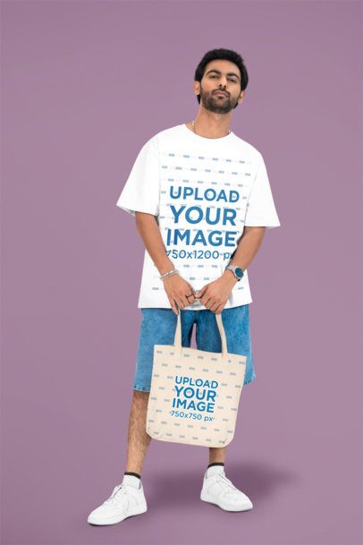 Oversized T-Shirt Mockup Featuring a Bearded Man Carrying a Tote Bag in a Studio