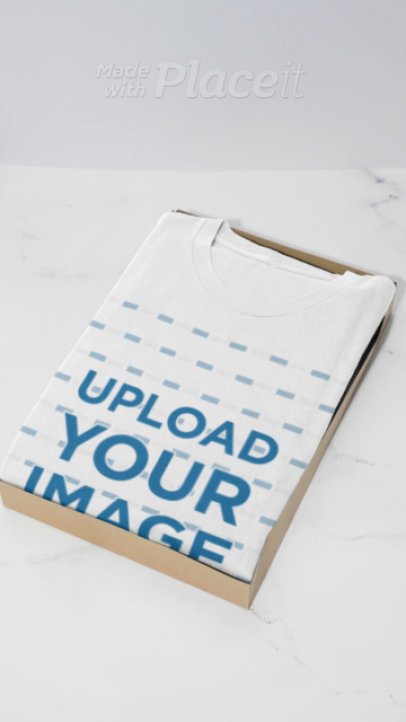 Video of a Person Opening a Box With a Folded Bella Canvas T-Shirt