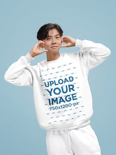 Crewneck Sweatshirt Mockup of a Teenage Boy Standing Against a Colorful Background