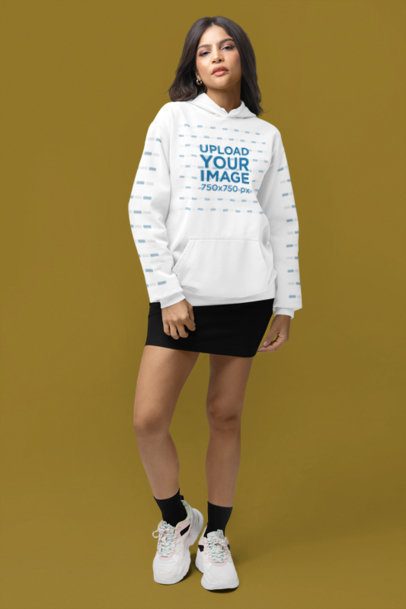 Comfort Colors Mockup of a Woman With a Pullover Hoodie and Customizable Sleeves Posing in a Studio m53142