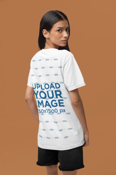 Back-View Mockup Featuring a Woman With a T-Shirt by Comfort Colors Posing in a Studio m53012