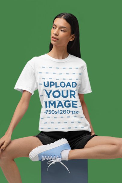Comfort Colors Round-Neck Tee Mockup of a Woman Sitting in a Cube in a Studio m53016