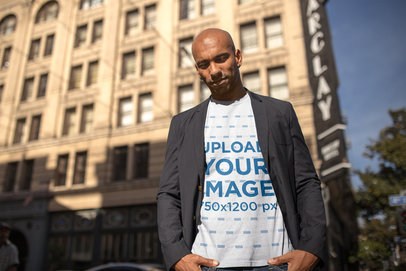 Mockup of a Man Wearing a T-Shirt in the City