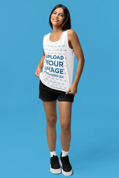 Comfort Colors Tank Top Mockup of a Woman Posing in a Studio With a Cheerful Look m53197