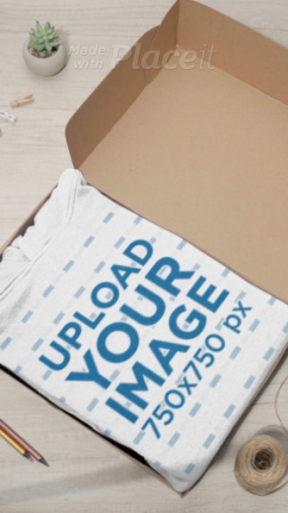 Cotton Heritage Video Featuring a Folded Pullover Hoodie Placed Inside a Box 9030v